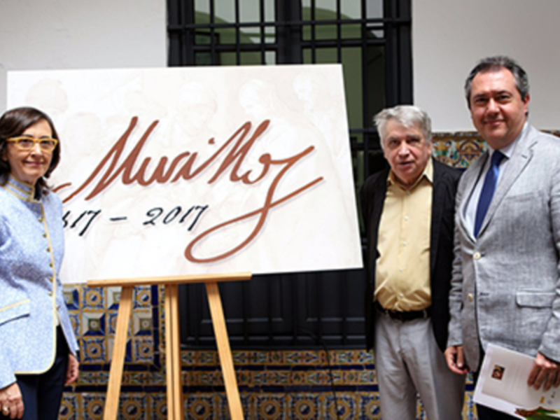 Presentación de un documento oficial con la firma de Muriel Noz, en una ceremonia formal.