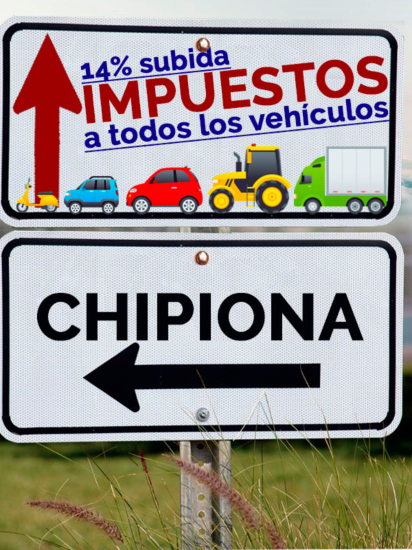 Signos indicando subida de impuestos para todos los vehículos y dirección a Chipiona.