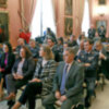 Personalidades militares, autoridades, de Universidades y de turismo en la Sala Colón del  Ayuntamiento de Sevilla en el acto