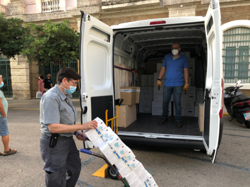 Person handling medical supplies in a van