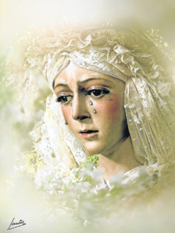 Retrato de la Virgen con vestimentas blancas y detalles florales, rodeada de luz y flores.